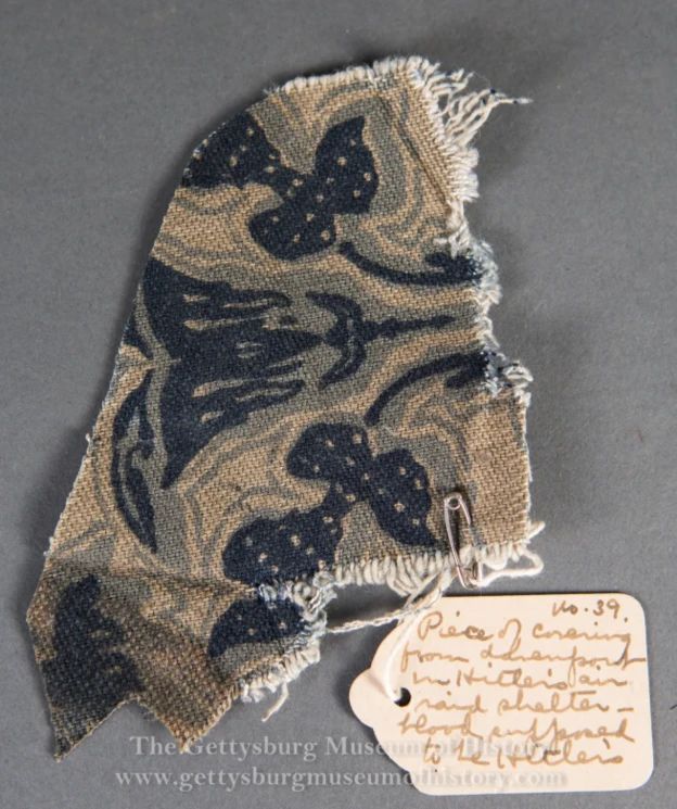 Blood-stained fabric swatch associated with Adolf Hitler's Berlin bunker sofa