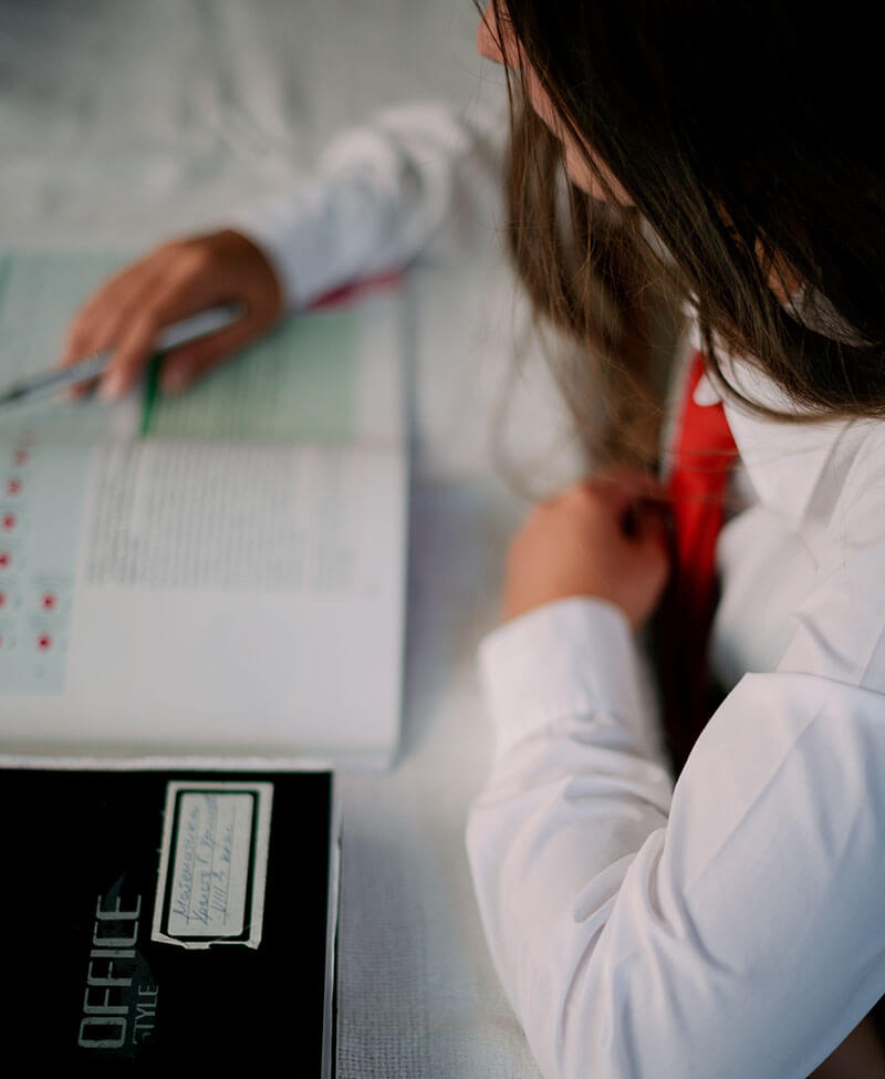 Genealogist working with historical family records